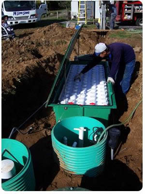 An Advantex AX-20 fabric filter being installed on a site with marginal soils.